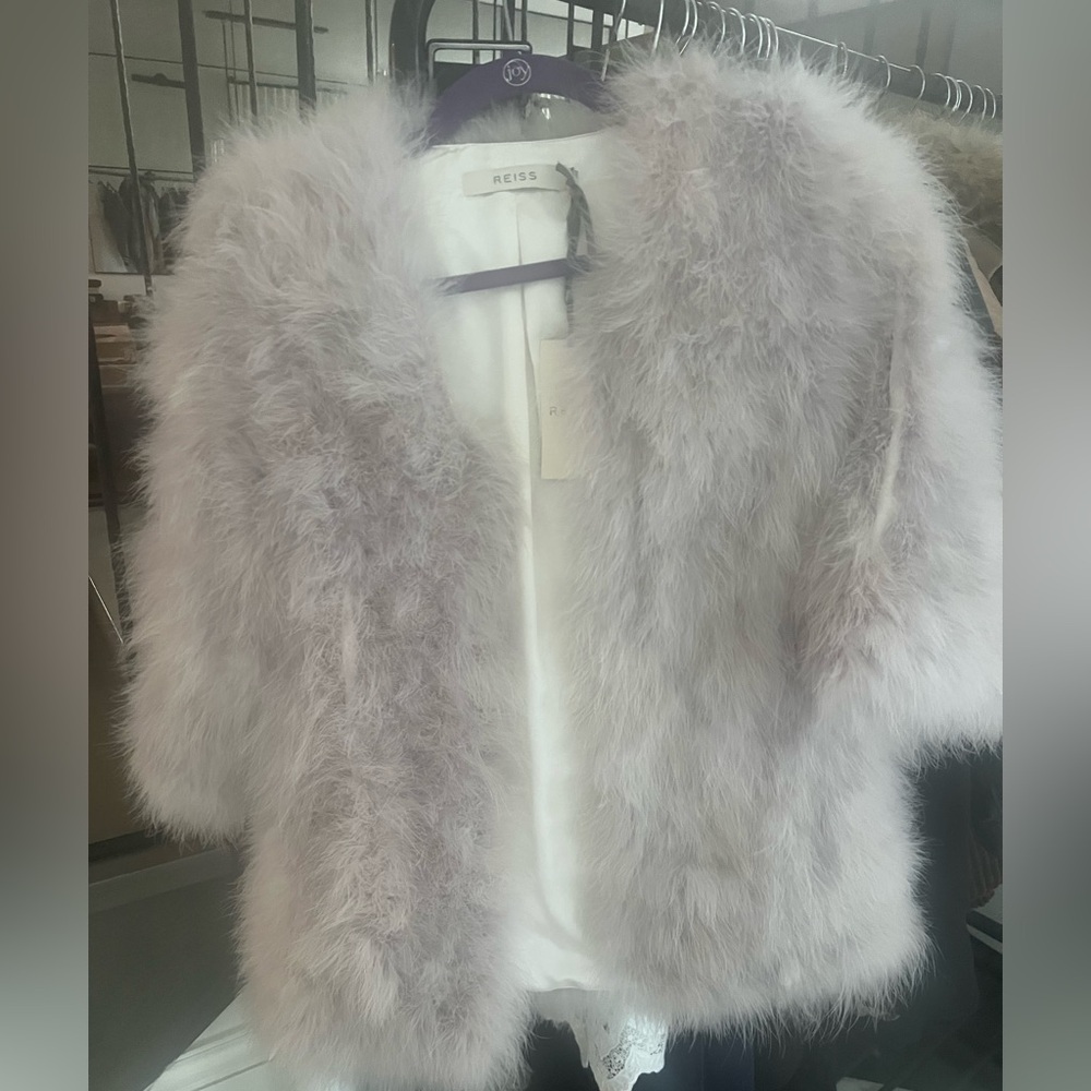 Beautiful throw on jacket with black belt feather texture, brand new never worn